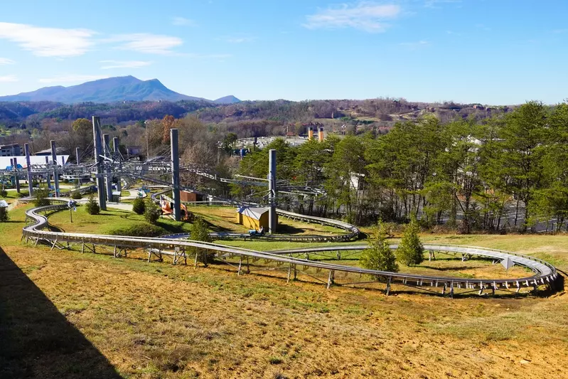 Rowdy Bear's Smoky Mountain Snowpark coasters with view of Pigeon Forge and Smoky Mountains