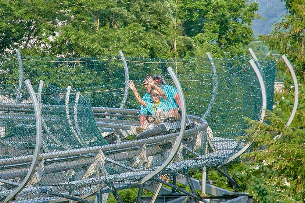 Mom and daughter riding Alpine Coaster